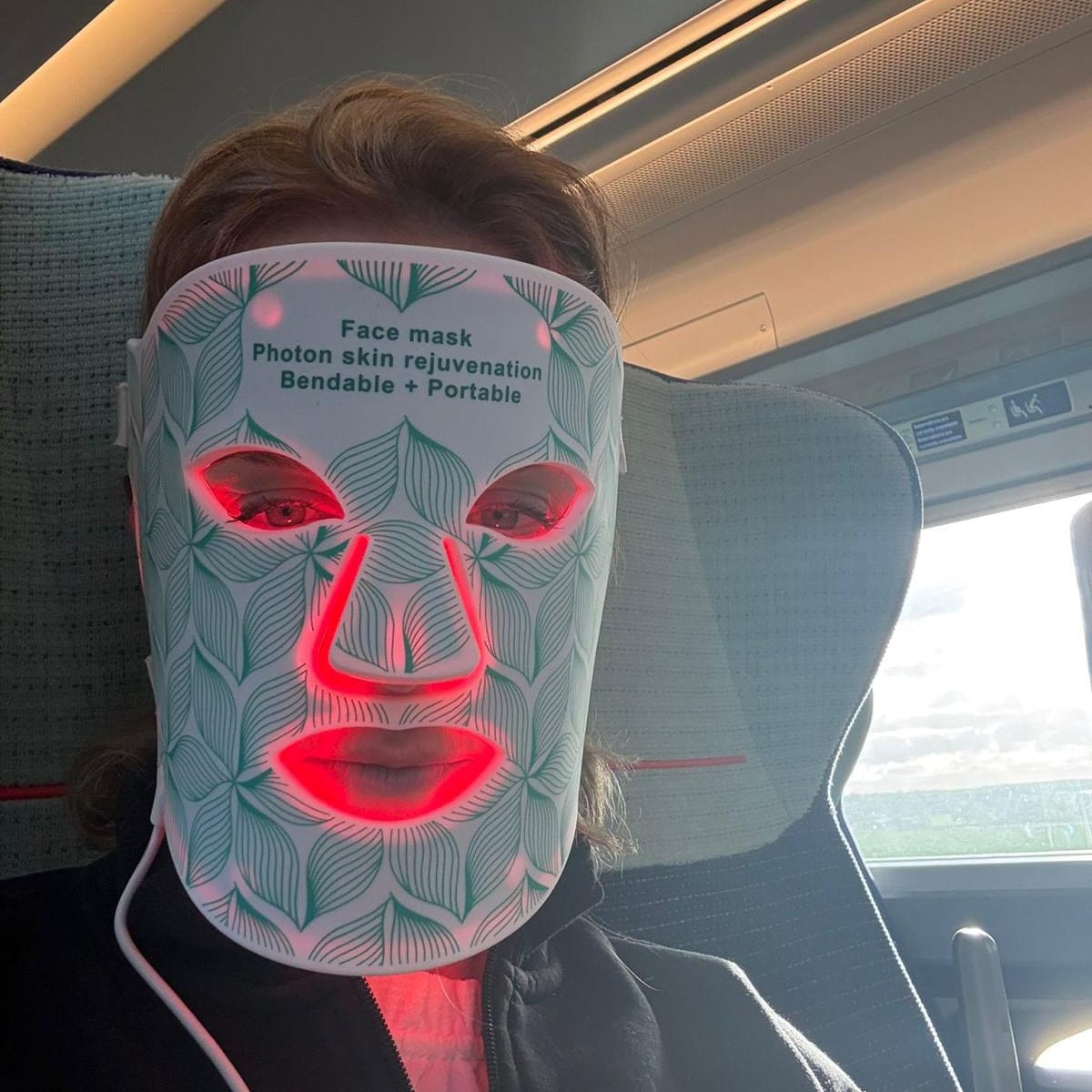 face mask led on a train